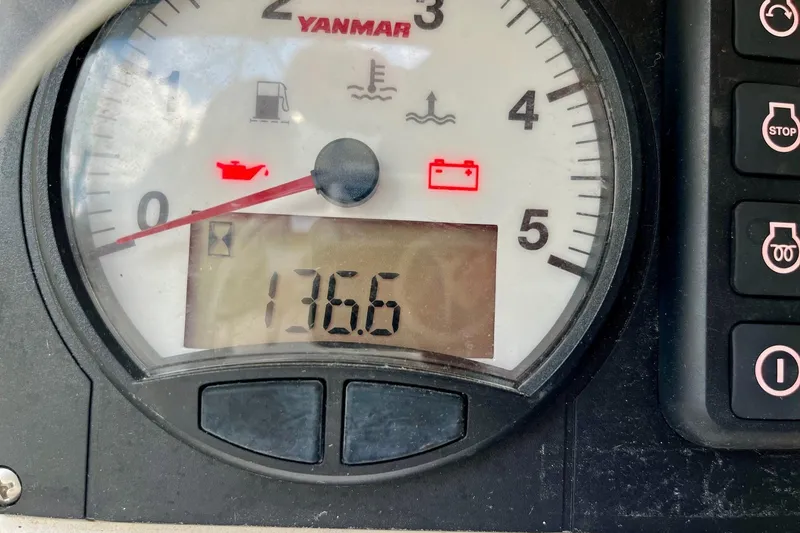 Slide: The Image of Close-up of Yanmar engine gauge on 2012 Alerion Express 28, showing 136.6 hours. - 13