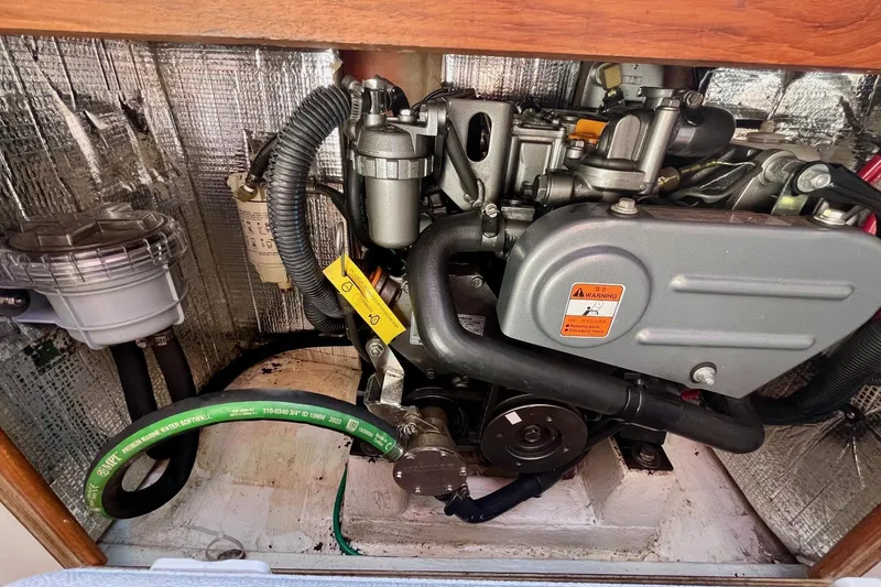 Slide: The Image of Engine compartment of a 2012 Alerion Express 28 sailboat, showcasing detailed components. - 16