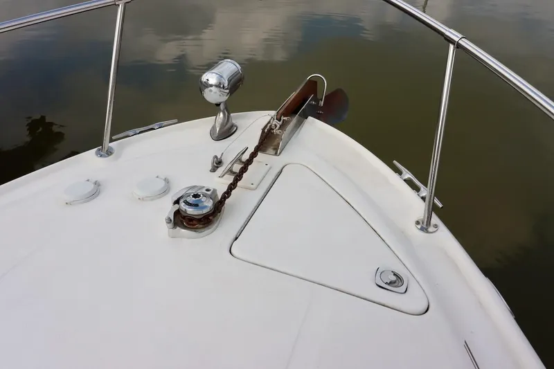 Slide: The Image of Bow of 2000 Sea Ray 270 Sundancer with anchor and railing. - 12