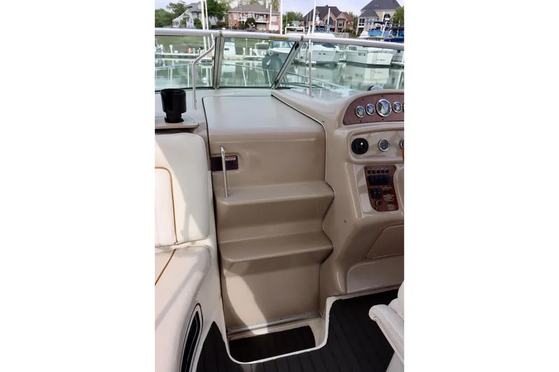 Slide: The Image of Cockpit view of 2000 Sea Ray 270 Sundancer with control panel and seating. - 19
