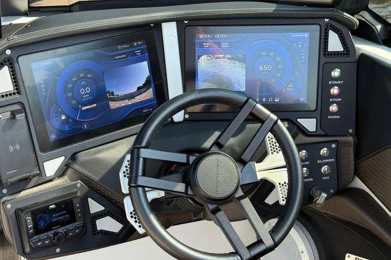 Slide: The Image of 2025 Centurion Ri245 dashboard with dual touchscreens and modern steering wheel. - 12