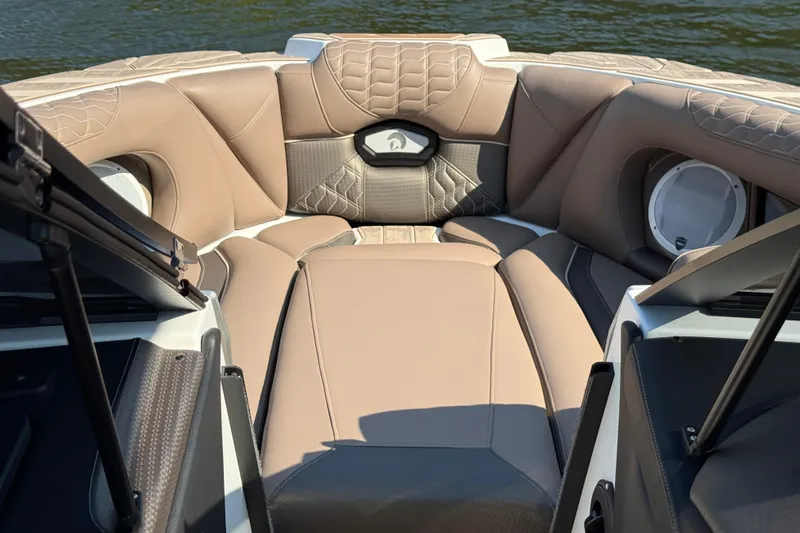 Slide: The Image of 2025 Centurion Ri245 boat interior with luxurious tan seating and modern design. - 14