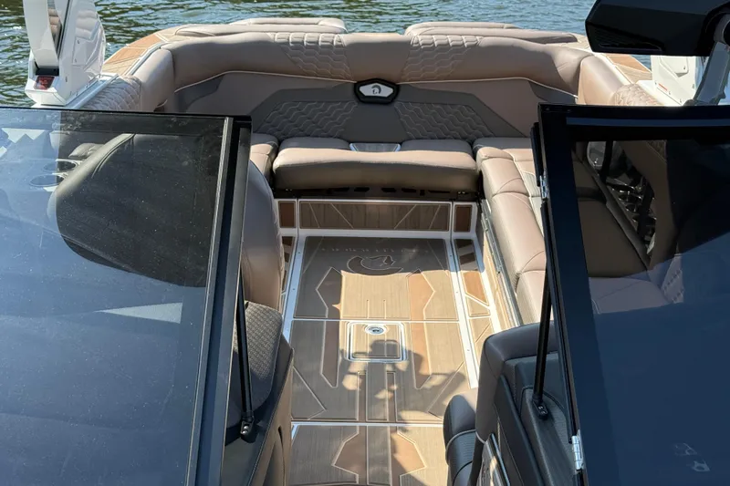 Slide: The Image of 2025 Centurion Ri245 boat interior with luxurious seating and modern design. - 15