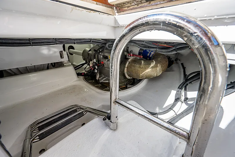 Slide: The Image of Engine compartment of 2022 Maverick 50 Sport Yacht, showcasing mechanical components and wiring. - 50