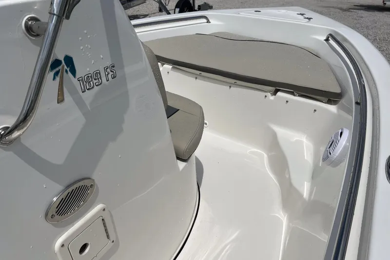 Slide: The Image of 2026 Key West 189 FS boat interior with seating and speaker. - 11