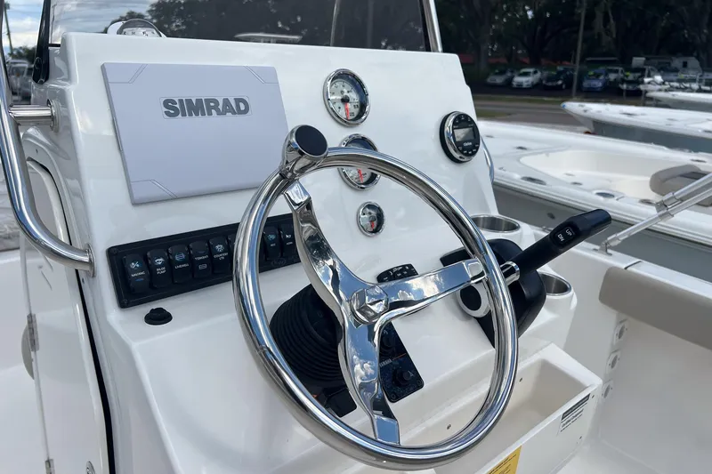 Slide: The Image of Steering console of 2026 Key West 189 FS boat with Simrad display and gauges. - 7