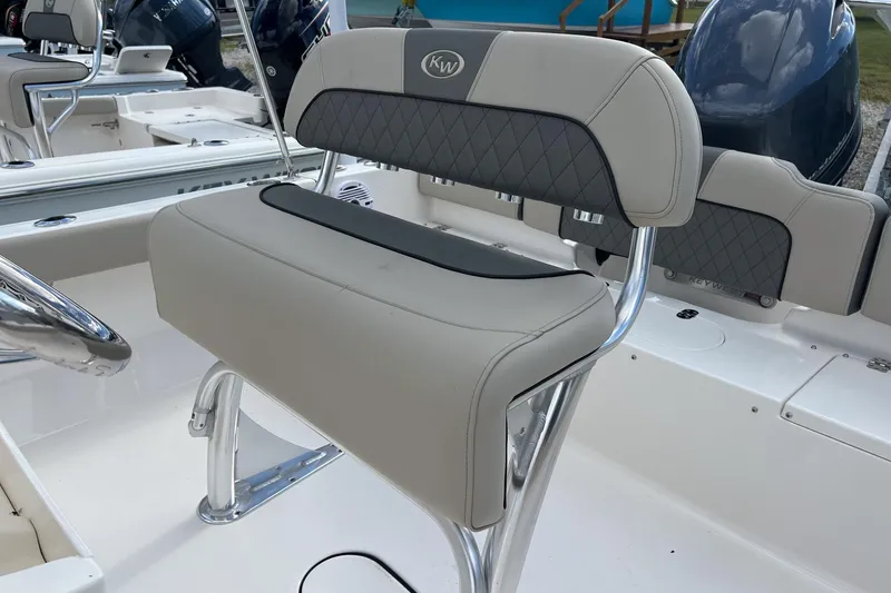 Slide: The Image of 2026 Key West 189 FS boat interior with cushioned seating and sleek design. - 9