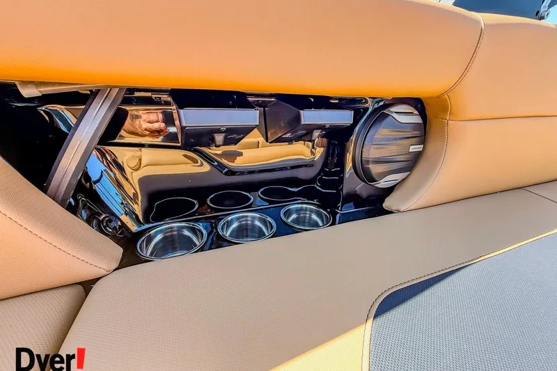 Slide: The Image of 2026 MasterCraft NXT23 interior with cup holders and speaker detail. - 10