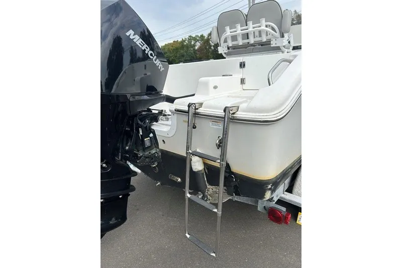 Slide: The Image of 2019 Sea Pro 219 boat with Mercury engine and rear ladder on trailer. - 14