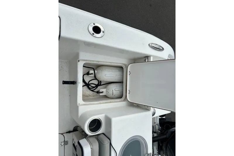 Slide: The Image of 2019 Sea Pro 219 boat storage compartment with fenders and ropes. - 15