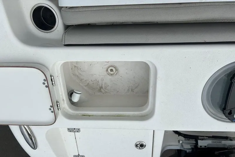 Slide: The Image of 2019 Sea Pro 219 boat interior with storage compartment and seating area. - 21