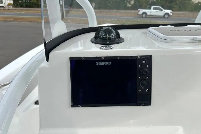Slide: The Image of 2019 Sea Pro 219 boat dashboard with Simrad display and compass. - 27