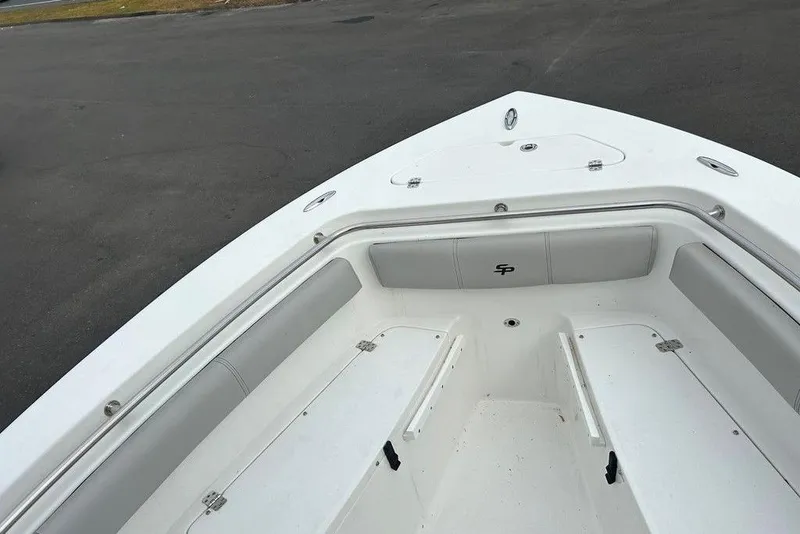 Slide: The Image of 2019 Sea Pro 219 boat interior with cushioned seating and storage compartments. - 32