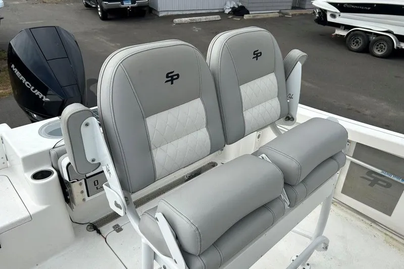 Slide: The Image of 2019 Sea Pro 219 boat with gray cushioned seats and Mercury engine. - 33