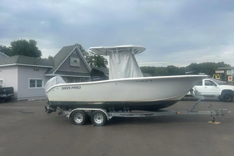 Slide: The Image of 2019 Sea Pro 219 boat on trailer, parked outside a building. - 36
