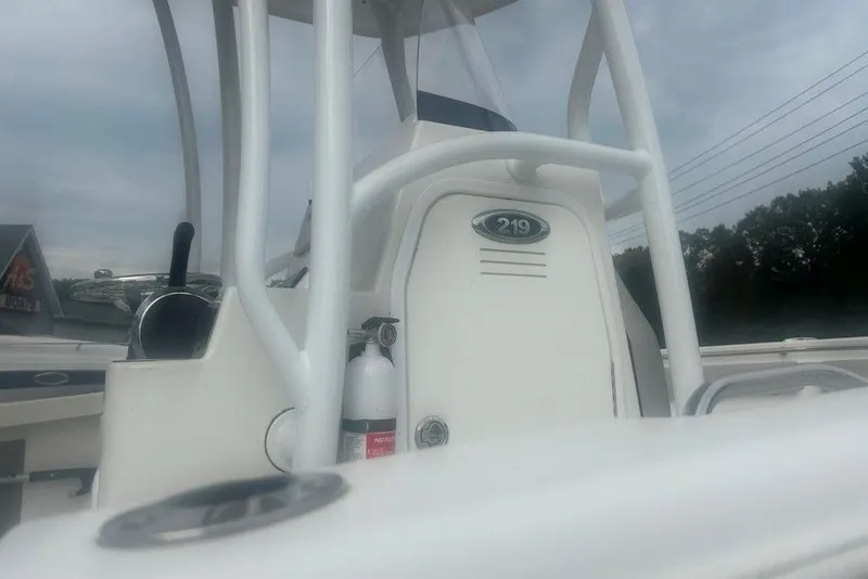 Slide: The Image of 2019 Sea Pro 219 boat console with steering wheel and fire extinguisher. - 4