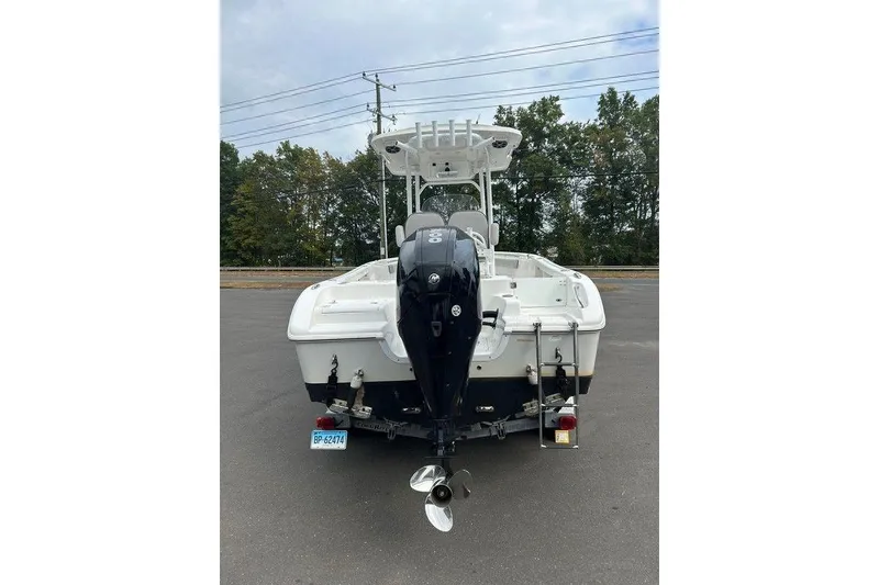 Slide: The Image of 2019 Sea Pro 219 boat, rear view with outboard motor, parked on asphalt. - 6