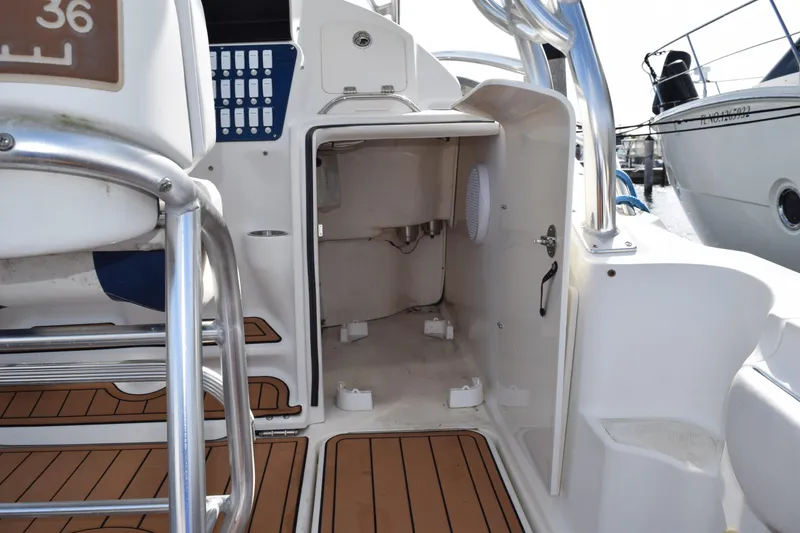 Slide: The Image of 2008 Hydra-Sports Vector 3300 VX boat dashboard with rod holders and measurement scale. - 100