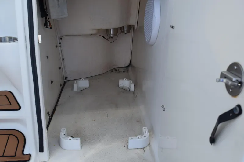 Slide: The Image of 2008 Hydra-Sports Vector 3300 VX boat interior with speaker and metal framework. - 104