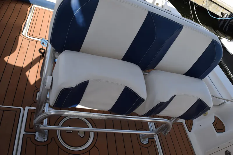 Slide: The Image of Steering wheel and controls of a 2008 Hydra-Sports Vector 3300 VX boat. - 107