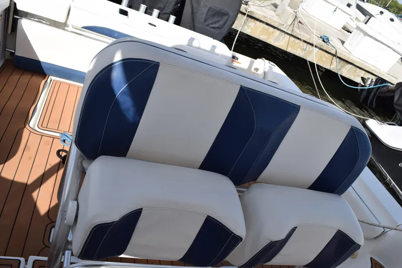 Slide: The Image of Control panel of 2008 Hydra-Sports Vector 3300 VX boat with switches and throttle levers. - 108