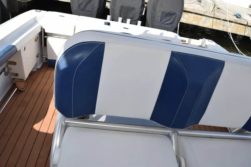 Slide: The Image of 2008 Hydra-Sports Vector 3300 VX boat deck with stainless steel railings and storage compartments. - 114