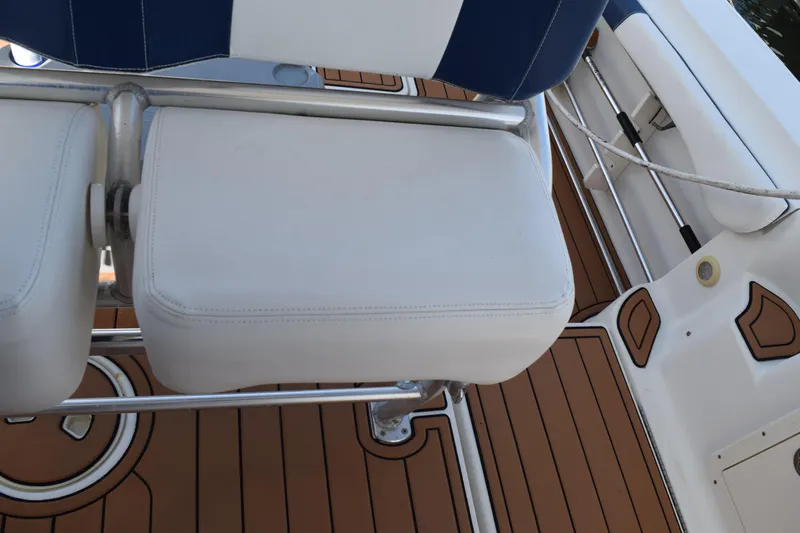 Slide: The Image of 2008 Hydra-Sports Vector 3300 VX boat interior with teak flooring and cup holder. - 115
