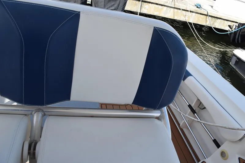 Slide: The Image of 2008 Hydra-Sports Vector 3300 VX boat docked at a marina, surrounded by other vessels. - 116