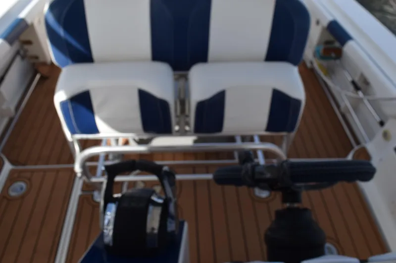 Slide: The Image of 2008 Hydra-Sports Vector 3300 VX interior with cup holders and storage compartment. - 119