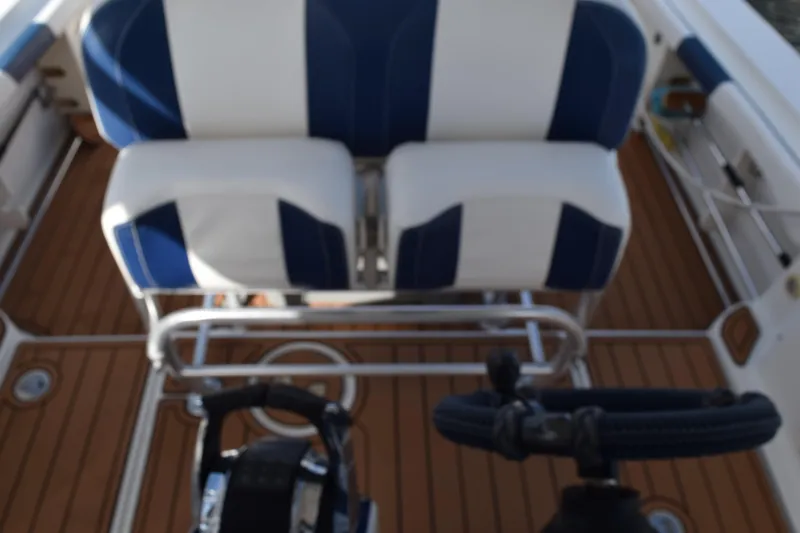 Slide: The Image of 2008 Hydra-Sports Vector 3300 VX boat interior with cup holders and storage compartment. - 120