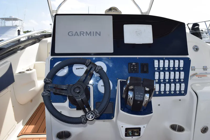 Slide: The Image of 2008 Hydra-Sports Vector 3300 VX docked at marina with other boats. - 128