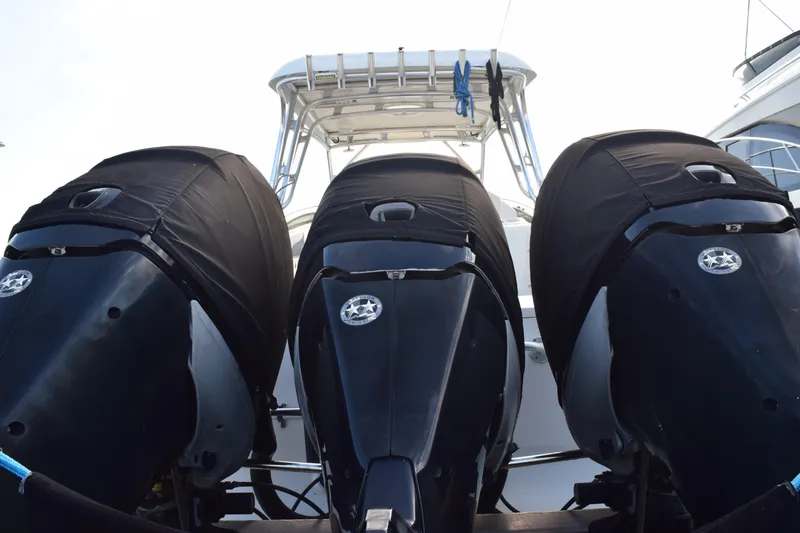 Slide: The Image of 2008 Hydra-Sports Vector 3300 VX boat docked with twin outboard engines. - 13
