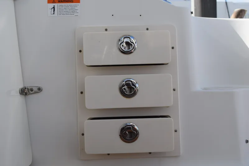 Slide: The Image of 2008 Hydra-Sports Vector 3300 VX interior detail with teak-style flooring and storage compartments. - 138