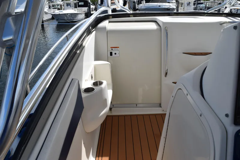 Slide: The Image of 2008 Hydra-Sports Vector 3300 VX boat docked at marina, view of deck and surroundings. - 147