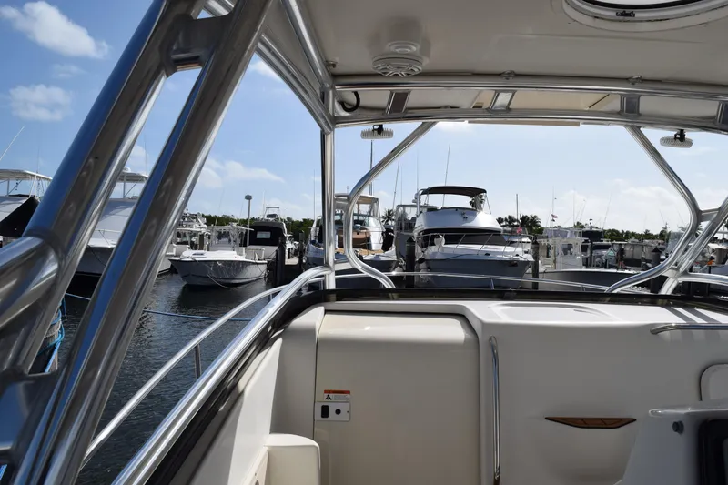 Slide: The Image of 2008 Hydra-Sports Vector 3300 VX docked at marina with other boats. - 149