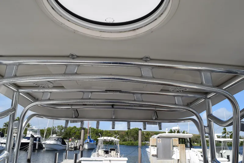 Slide: The Image of 2008 Hydra-Sports Vector 3300 VX docked, featuring sleek design and wooden deck. - 164