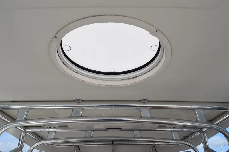 Slide: The Image of 2008 Hydra-Sports Vector 3300 VX boat deck with blue rope and water view. - 165