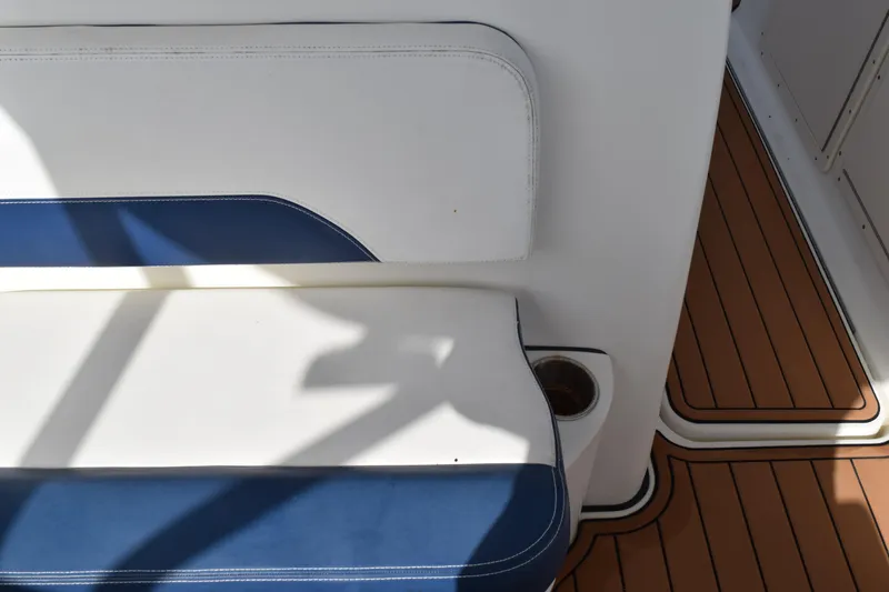 Slide: The Image of 2008 Hydra-Sports Vector 3300 VX boat cleat with blue rope and metal fittings. - 166