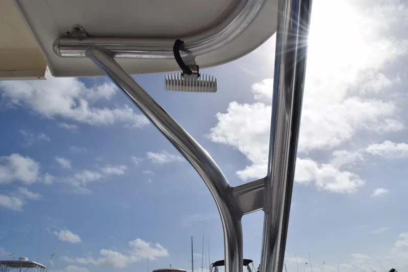 Slide: The Image of 2008 Hydra-Sports Vector 3300 VX spotlight on deck, under clear blue sky. - 178