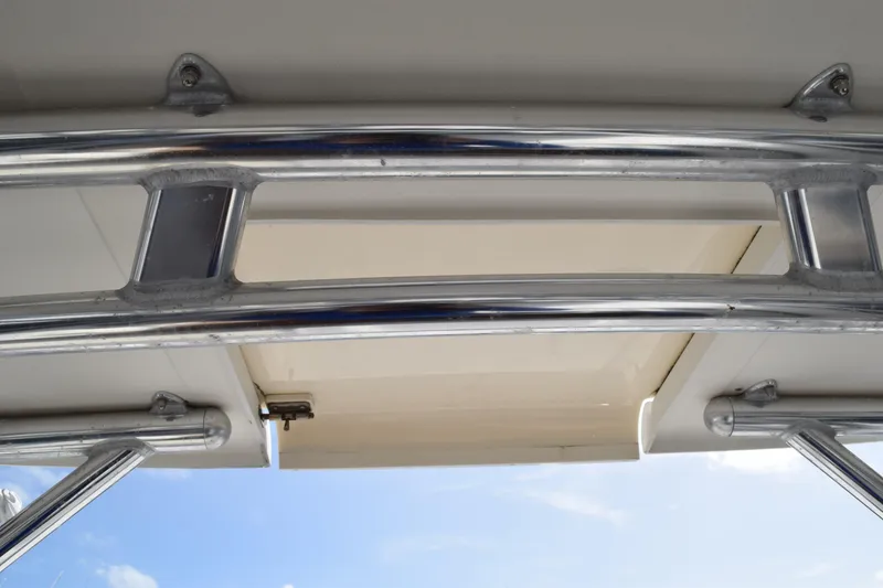 Slide: The Image of 2008 Hydra-Sports Vector 3300 VX deck detail with blue rope and metal fixture. - 183