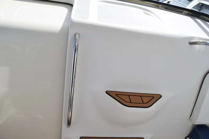 Slide: The Image of 2008 Hydra-Sports Vector 3300 VX boat deck with metal fixtures and textured surface. - 185