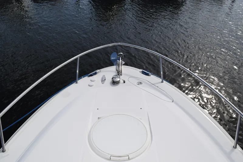 Slide: The Image of 2008 Hydra-Sports Vector 3300 VX boat deck with stainless steel railings and wood-like flooring. - 188