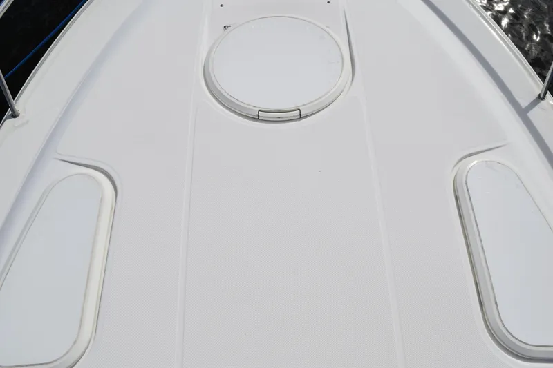 Slide: The Image of 2008 Hydra-Sports Vector 3300 VX boat deck with teak flooring and stainless steel railing. - 190