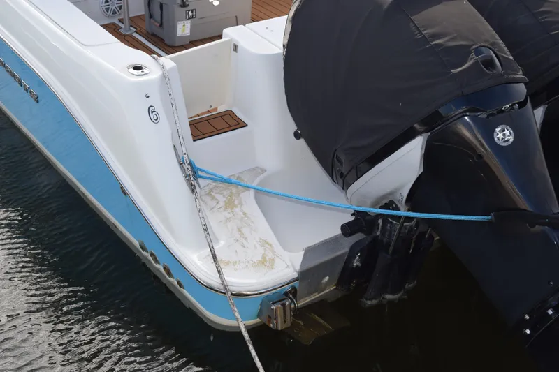 Slide: The Image of 2008 Hydra-Sports Vector 3300 VX boat deck with blue rope and metal railings. - 20