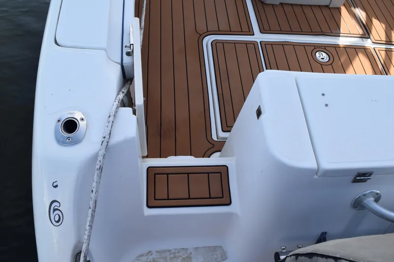 Slide: The Image of 2008 Hydra-Sports Vector 3300 VX boat deck with teak flooring and storage hatch. - 37