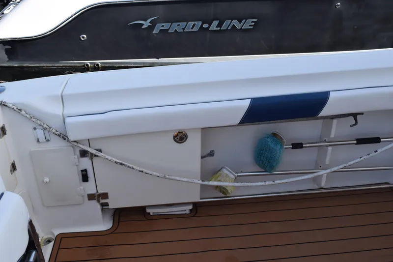 Slide: The Image of 2008 Hydra-Sports Vector 3300 VX boat deck with teak-style flooring and storage compartments. - 66