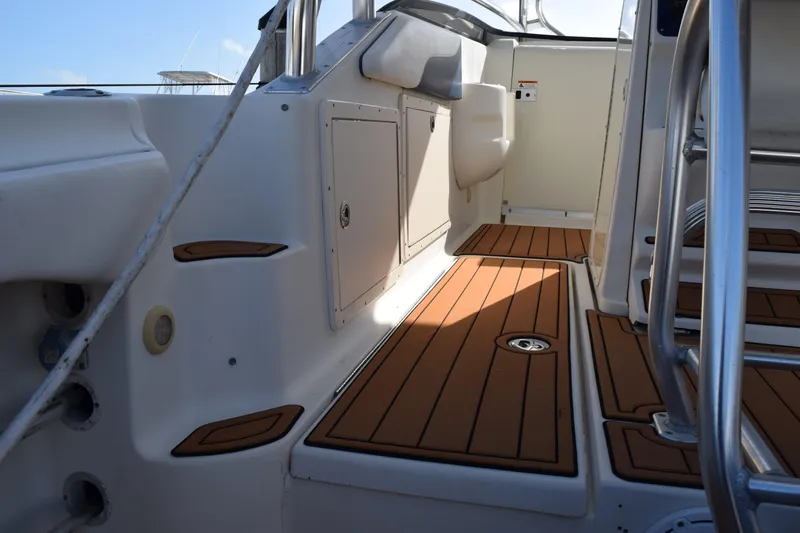 Slide: The Image of 2008 Hydra-Sports Vector 3300 VX boat deck with teak flooring and stainless steel fittings. - 70