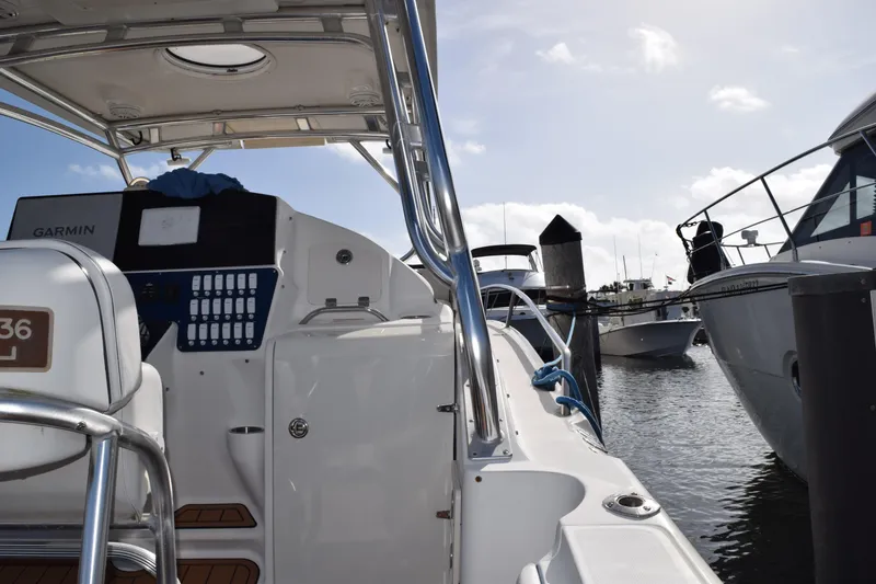 Slide: The Image of 2008 Hydra-Sports Vector 3300 VX boat interior with storage compartment and control panel. - 77
