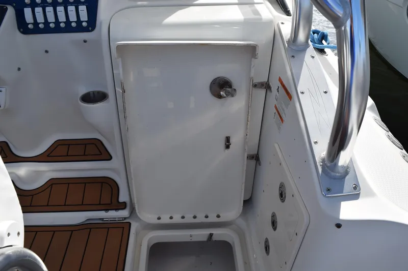 Slide: The Image of 2008 Hydra-Sports Vector 3300 VX boat with rod holders and ropes against a clear sky. - 82