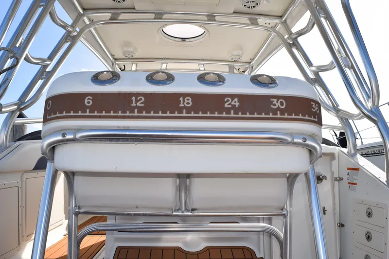 Slide: The Image of 2008 Hydra-Sports Vector 3300 VX boat with rod holders under a bright sun. - 85